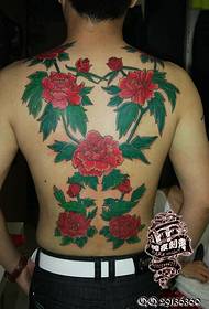 Blomme tatoeëringpatroon met 'n volledige rug