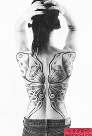 Žena kreatívne plné chrbát motýľ tetovanie