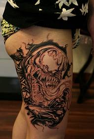very evil black and white tattoo pattern outside the thigh
