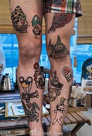 Various small tattoo patterns on the legs