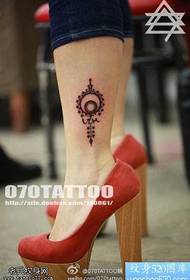Totem sun tatu corak untuk trend kaki