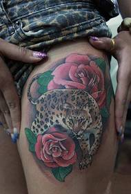 domineering leopard rose thigh tattoo