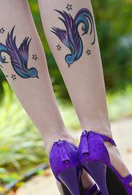 beautiful Swallow totem tattoo on a beautiful calf