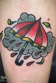 Umbrella tattoo on the calf