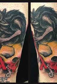 Tatuaggio di ratto sul polpaccio