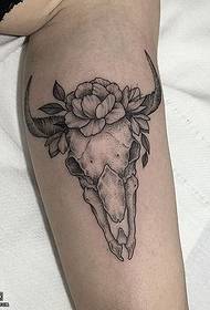 Sheep's head tattoo with stinged legs