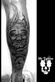 Dharma tattoo on the calf