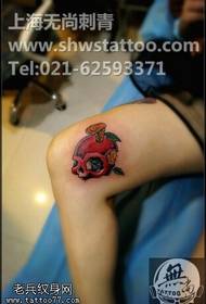 ຮູບແບບ tattoo ກະໂຫຼກຫົວ ໝາກ ໂປມນ້ອຍ