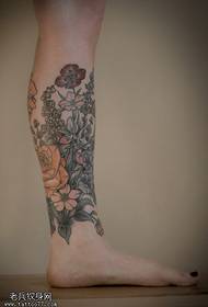 Calf floral tattoo ụkpụrụ