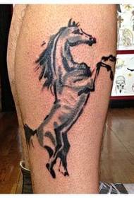 Beautiful atmospheric horse tattoo on the calf
