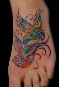 美しい女性の足の甲の鳥のタトゥー画像