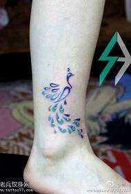 Peacock tattoo foto met beenkleur