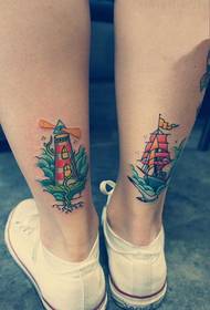 Sailboat sareng mercusuar gambar tato anak sapi