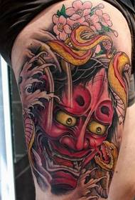 Tatuaggio classico prajna per coscia da ragazza