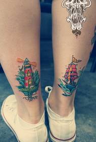 腿部彩色帆船灯塔纹身图案