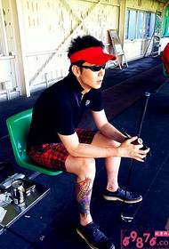 Male traditional squid flower calf tattoo picture