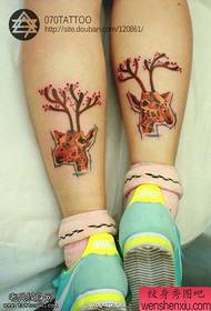 Woman legs colored antelope tattoos