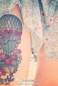 Woman legs colorful hot air balloon tattoos