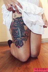 Woman leg owl tattoo work