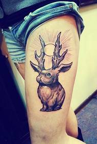 a woman's leg antelope rabbit tattoo pattern