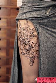 Woman legs flower tattoo work