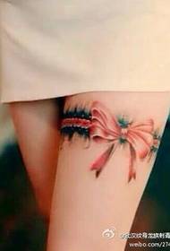 Tattoo show picture works: girl's leg bow tattoo
