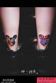 女人的腿彩色米奇蝴蝶結花紋身圖片