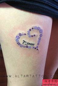 Beautiful floral love tattoos on beautiful thighs