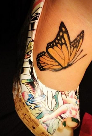 A yellow painted butterfly tattoo on the woman's foot