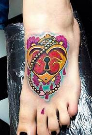 kaunis ja kaunis värilukko tatuointikuvion kuva jalkaterällä