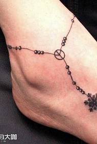 foet sneeuwvlokketting tattoo patroan