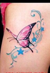 Foto di tatuaggi: coscia a farfalla con motivo a tatuaggio