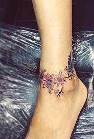 Beautiful garland tattoo pattern on the ankle