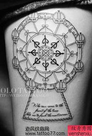 የውበት እግሮች Ferris wheel tattoo tattoo