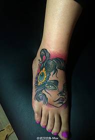 very cute Cartoon female doll foot tattoo