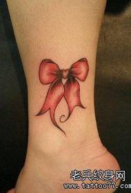 Opere per tatuaggio da donna con fiocco alla caviglia