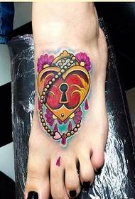 collo del piede femminile bellissimo colore blocco tatuaggio immagine apprezzamento foto