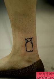 cute totem owl tattoo pattern at the girl's ankle