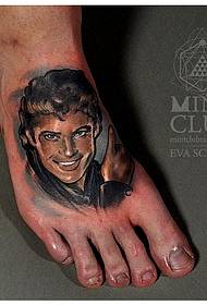 A portrait tattoo on the instep