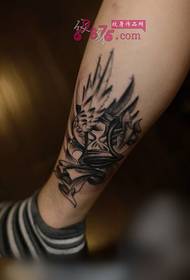 Europese zwart grijze vleugels zandloper enkel tattoo foto