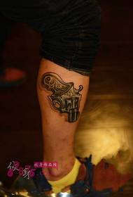 Picture Creative Revolver Shank Tattoo