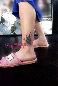 foto blu e vogël e tatuazhit të këmbës së këmbës