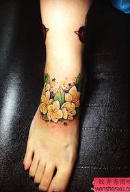 girl's instep is a beautiful floral tattoo pattern