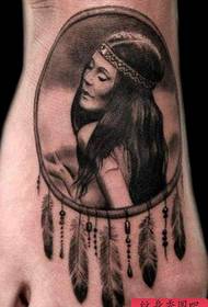 An Indian female portrait tattoo on the instep