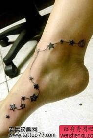 mudellu di tatuatu famusu di cinque stelle di punta à stella