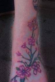 pied couleur fleur tatouage
