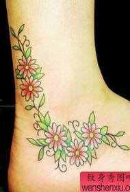 modello solo tatuaggio bellissimo fiore vite piede