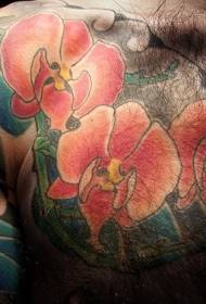 胸の赤い蘭のタトゥーパターン