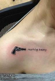 Chest clavicle kakang'ono ka pistol tattoo