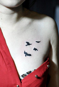 woman chest beautiful small totem bird tattoo picture